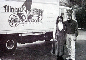 Mike and Lisa in front of one of their original piano moving trucks.